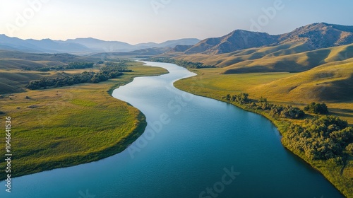 A drone capturing a serene river meandering through hills. photo