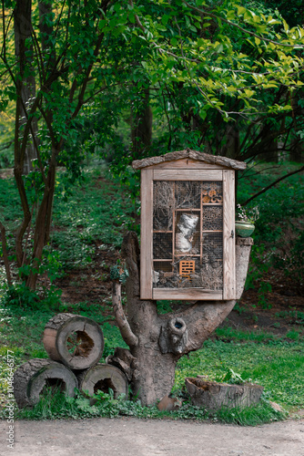 insect shelter ecology landscaped object wooden material life style concept in spring park space, vertical photography