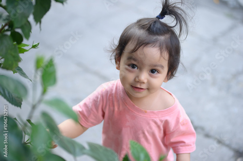 Natural light portrait cute asian girl smile, look at camera