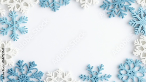 A decorative border of blue and white snowflakes on a blank background, perfect for winter-themed designs and holiday greetings.