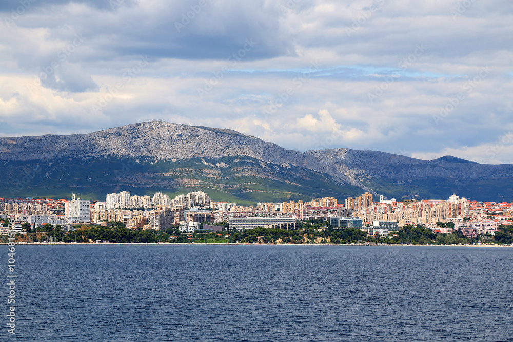 Fototapeta premium Contemporary buildings, gardens and beaches at the waterfront in Split, Croatia. View of Split from the boat.