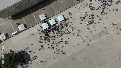 Aerial top down of crowd gathering near palasport arena before a sport event in Turin Italy photo
