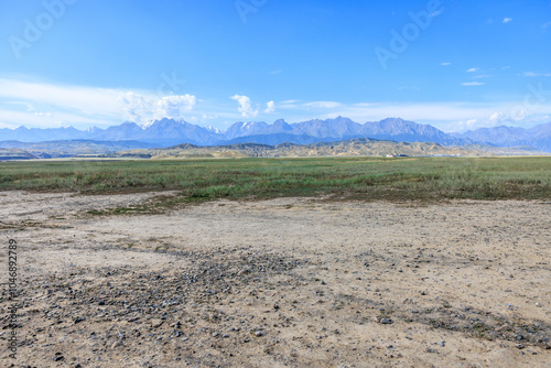 Dirt gravel road square and mountain natural landscape under blue sky. car background.