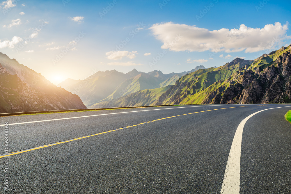 Asphalt road and green mountain with sky clouds natural landscape at sunset. road trip.