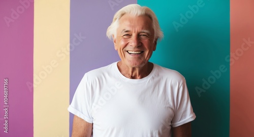 blonde elderly man colorful background wearing plain white tshirt smiling happy portrait