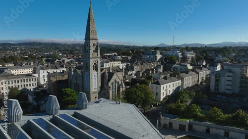 Maritime Museum, County Dublin, Dun Laoghaire, September 2024. Drone orbits clockwise while ascending above the LexIcon building with the old Mariners' Church Spire centered as focal point. photo