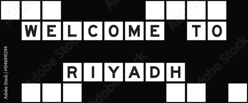 Alphabet letter in word welcome to riyadh on crossword puzzle background