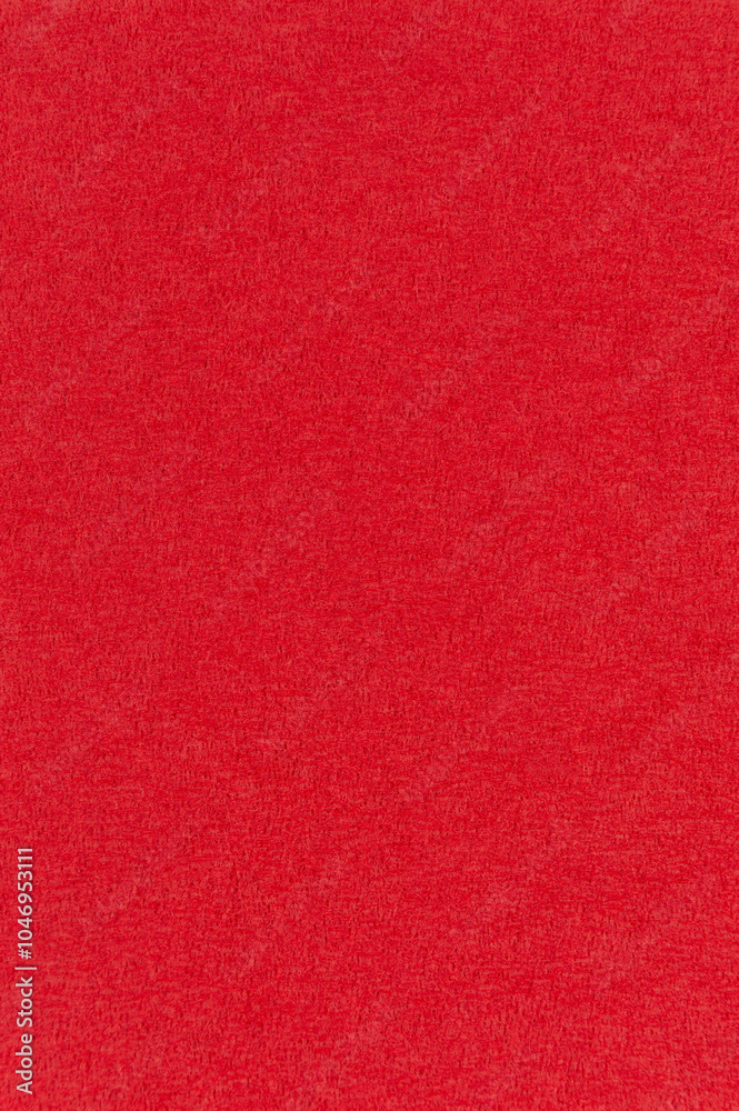 Fototapeta premium Macro image of a red paper napkin. Red textured vertical background image.