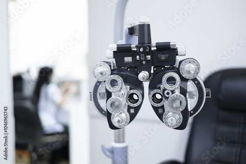Optometrist phoropter optical correcting device tools and equipment use to diagnose, examine and treat patients eyes optical vision. Professional specialist optician eye tool.