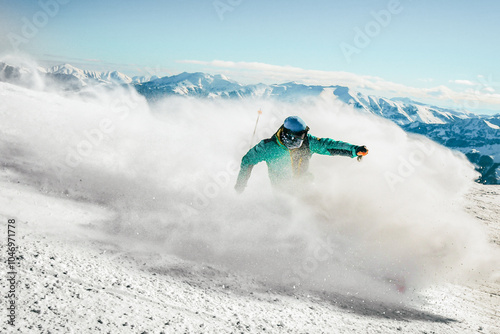 Fotografie Expert skier on the slopes in Winter snowy mountains sunny day outdoors carve spray snow