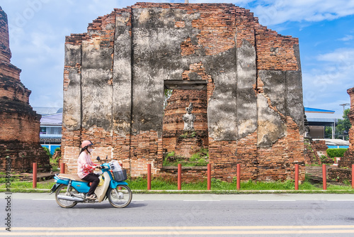 Ayutthaya, Thailand - April, 26, 2024 : Motorcycle Near Historic Site at Ayutthaya, Thailand. photo