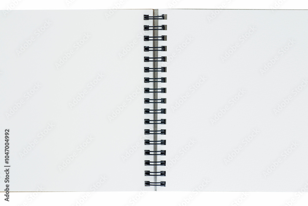 close up of opened sketch book with spiral bound against white close up of opened sketch book with spiral bound against white