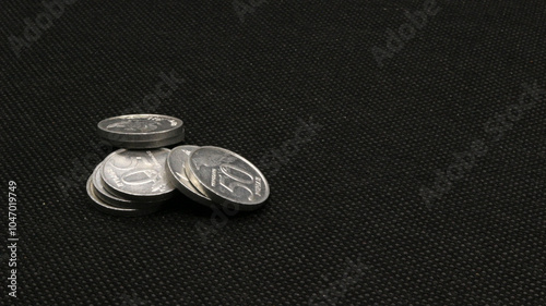 Stack of Indonesian coins isolated photo