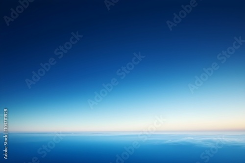 Expansive blue sky and ocean horizon during twilight hours