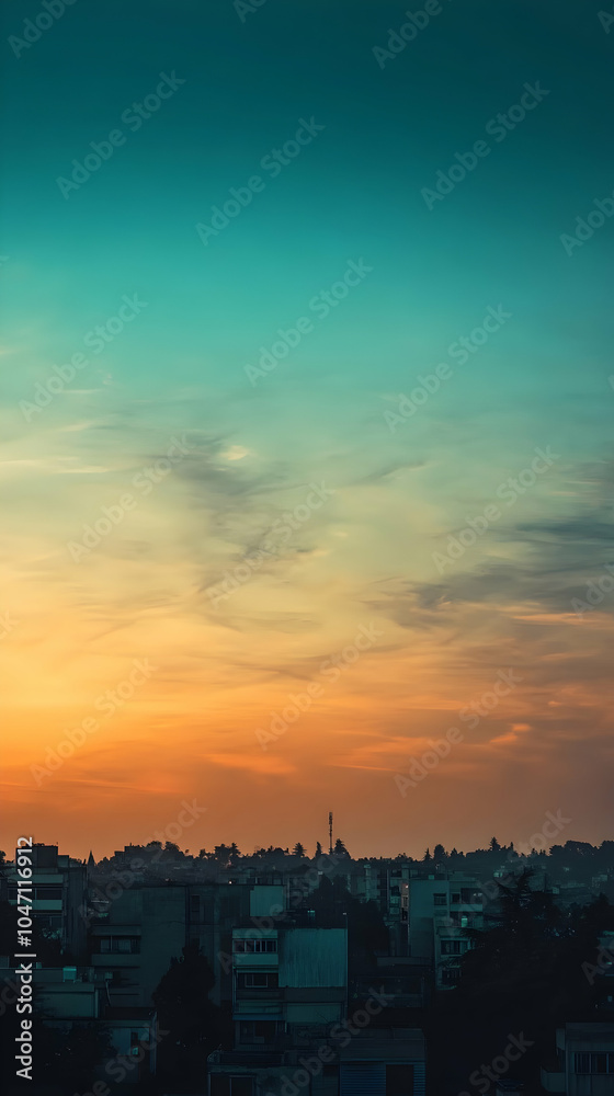 Obraz premium A panoramic view of a city skyline at sunset with a beautiful sky.