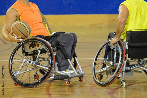 Wheelchair basketball players during a match photo