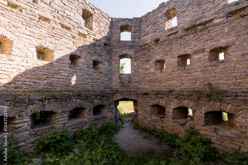 Abandoned Stone Ruins Surrounded by Nature with Multiple Arched Windows Abandoned Stone Ruins Surrounded by Nature with Multiple Arched Windows
