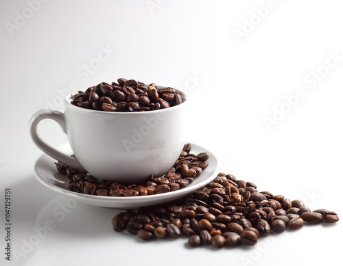 Coffee cup with coffee beans on side position provides copy space for text. background concept isolated white