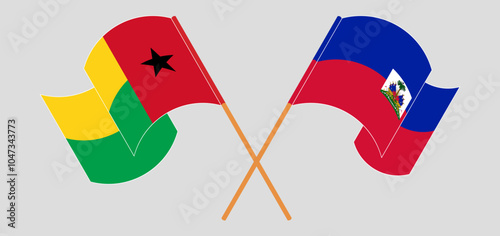 Crossed and waving flags of Guinea-Bissau and Republic of Haiti. Vector illustration