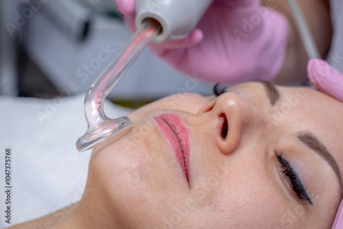 Darsonvalization, cosmetology application of high frequency currents for skin and hair care photo