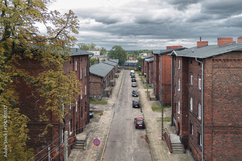 Old residential red brick houses built for railroad workers on Krótka street in Krzyż Wielkopolski, Poland. Autumn view