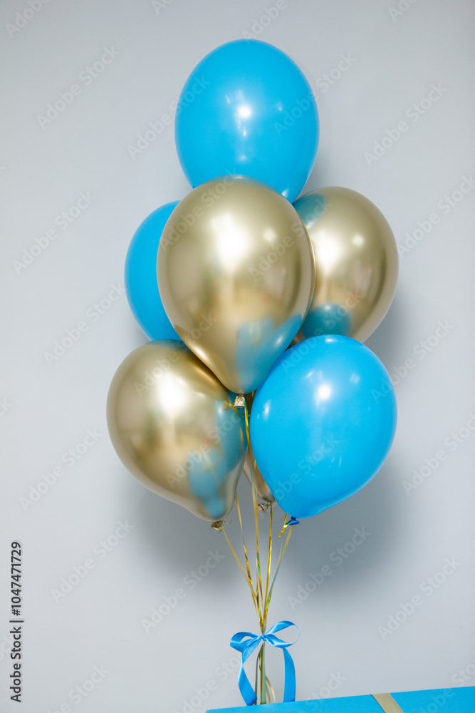 bouquet of blue and gold chrome balloons