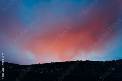 Epic panorama of Icelandic highland landscape: black volcanic mountains covered with soft green moss