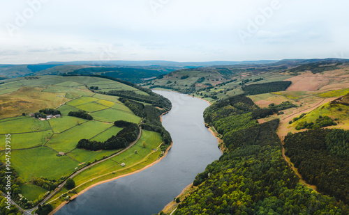 Aerial view wtih beautiful green landscape Derwent Dam, snake road bridge Peak District