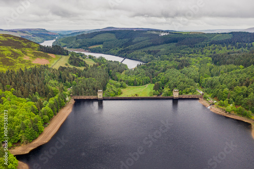 Aerial view wtih beautiful green landscape Derwent Dam, snake road bridge Peak District