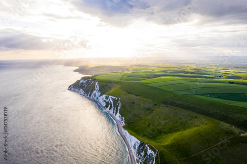 Aerial view wtih beautiful, UK England Europe Dorset Durdle Door Beach white cliff sunset photo