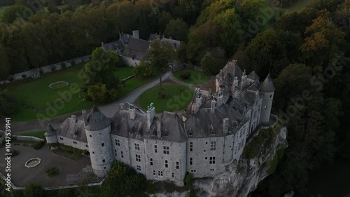 Discovering the enchanting beauty of Walzin Castle in the setting sun photo