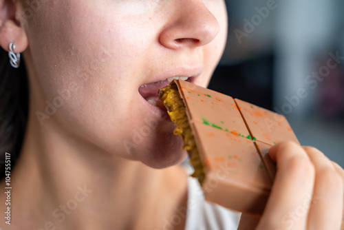 Canvas Print Woman eating trend Dubai chocolate with pistachio paste and kataifi dough