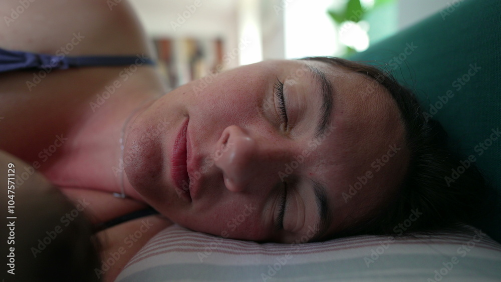 Woman sleeping soundly on a pillow with eyes closed, resting indoors in a relaxed and peaceful manner, showcasing a moment of tranquility and quiet Woman sleeping soundly on a pillow with eyes closed, resting indoors in a relaxed and peaceful manner, showcasing a moment of tranquility and quiet