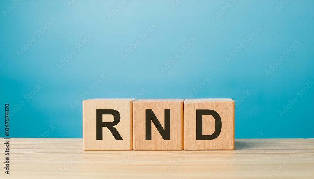 Wood cubes with abbreviation text RND on wooden table. Research and Development. Close-up. Wood cubes with abbreviation text RND on wooden table. Research and Development. Close-up.