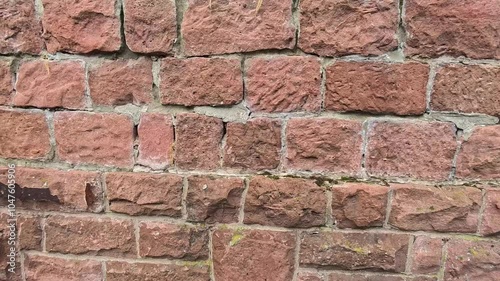 Exploring the Unique Texture of an Old Stone Wall in Historical Surroundings