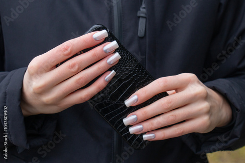 Stylish fashionable nail young woman hands mother -of -pearl manicure