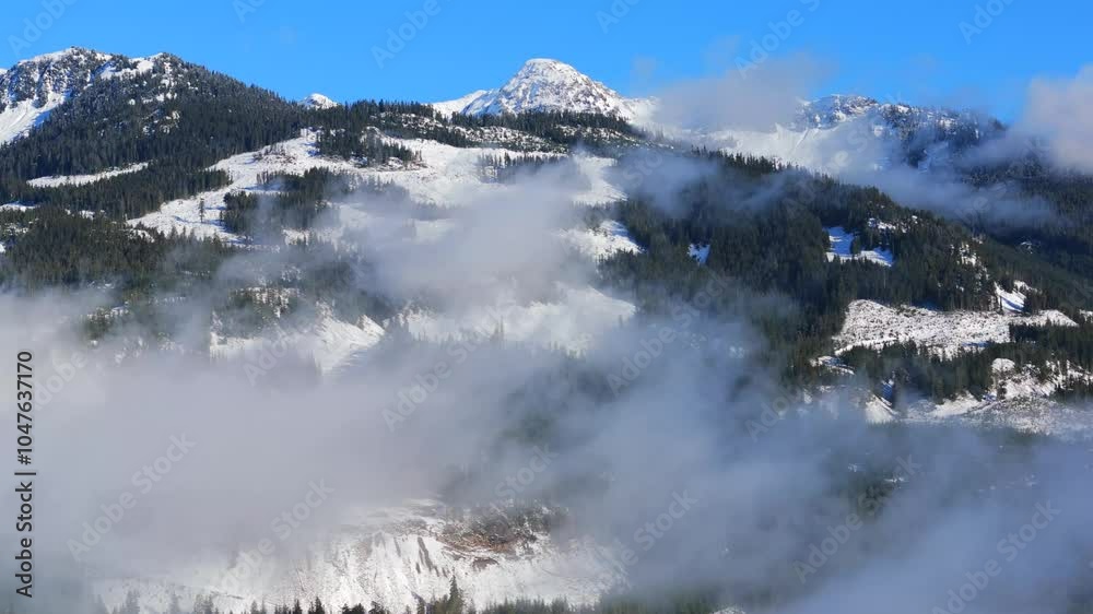 Aerial view on Canadian rocky mountain landscape covered in snow Aerial view on Canadian rocky mountain landscape covered in snow