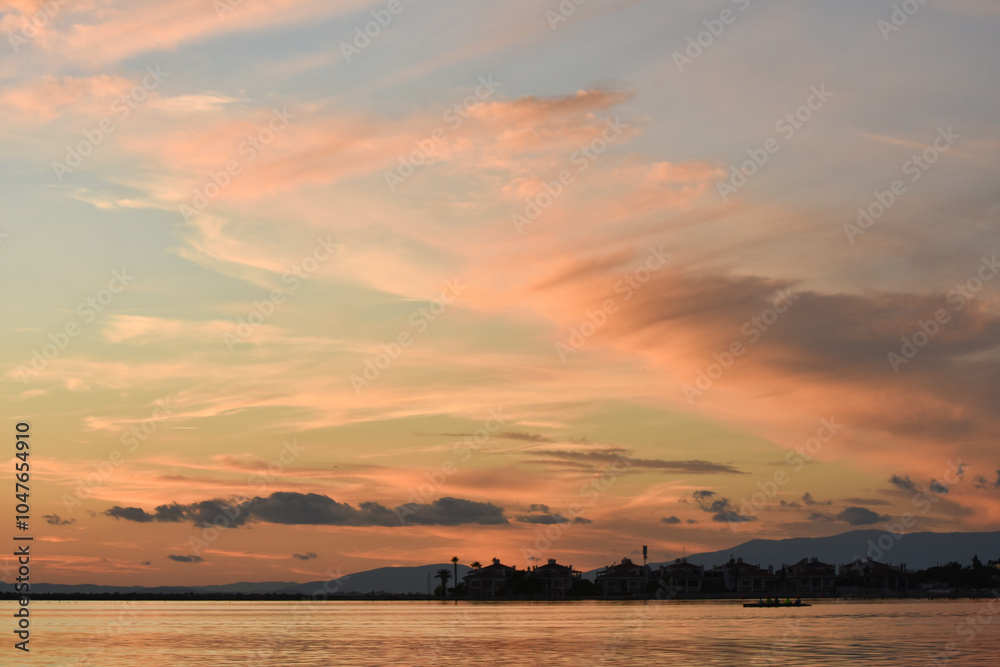 Beautiful, colorful clouds at sunset sky on a sea Beautiful, colorful clouds at sunset sky on a sea