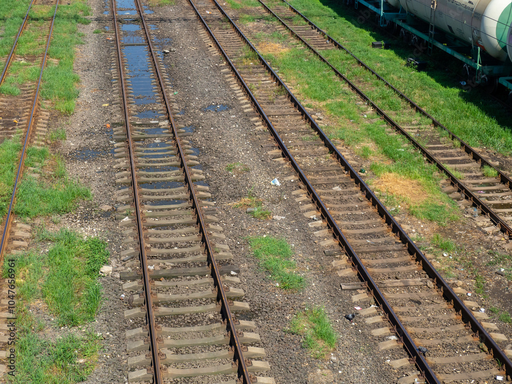 Obraz premium Rails with sleepers. Many tracks. Railway tracks. Railway crossing.