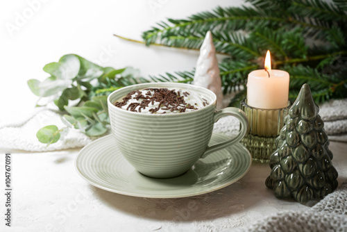 Wallpaper Mural Green cup with hot chocolate and whipped cream, candle, twigs and Christmas decoration on a light background, sweet drink for cozy days at home, copy space, selected focus Torontodigital.ca