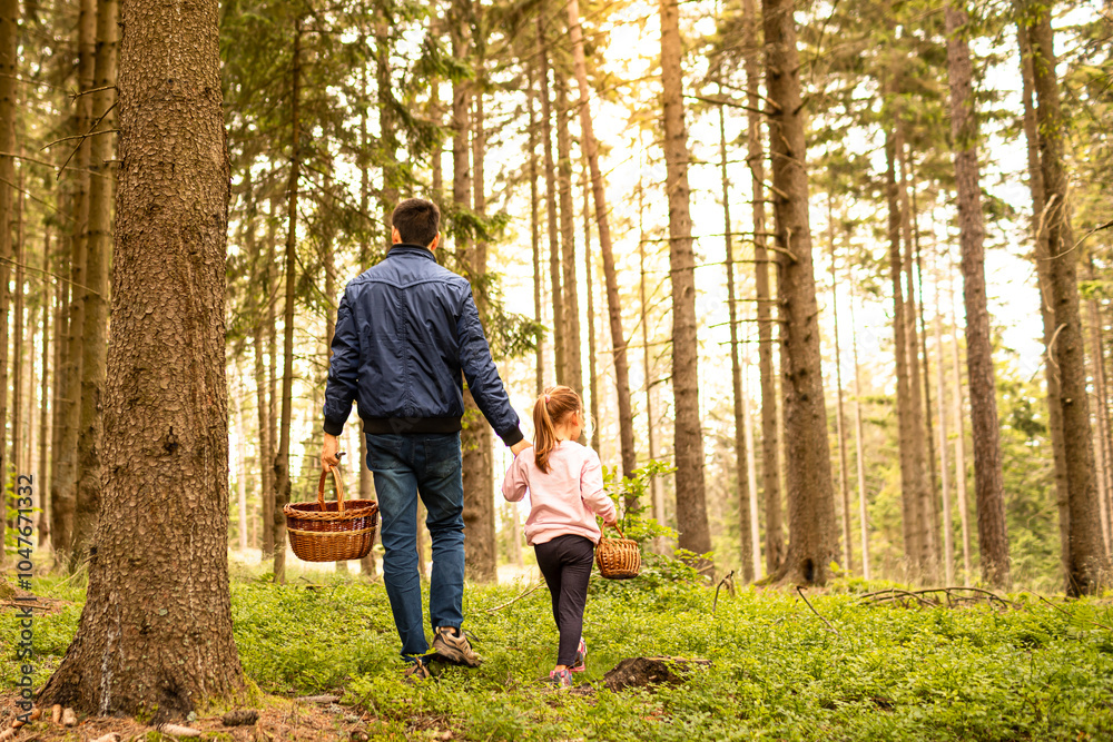 Father child walking in the forest going blueberry mushroom picking, family outdoor nature activities, leisure father daughter bonding Father child walking in the forest going blueberry mushroom picking, family outdoor nature activities, leisure father daughter bonding