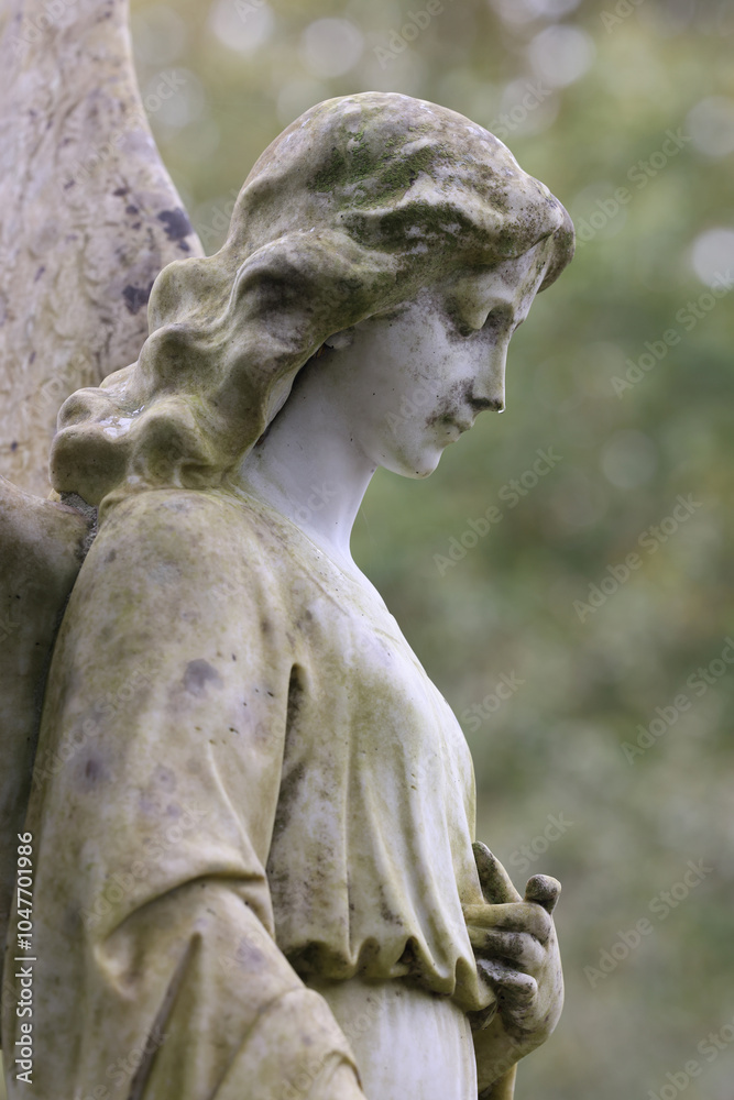 Angel statue on an old grave