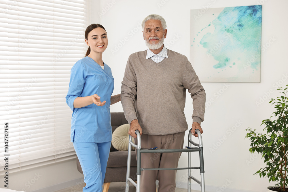 Nurse helping senior man with walking frame in clinic Nurse helping senior man with walking frame in clinic