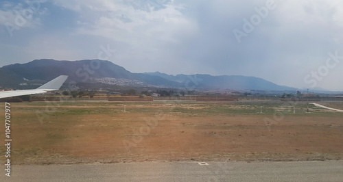 The view around the city of Malaga, Spain from the window of an Airbus A340 taxiing at Costa del Sol Airport photo