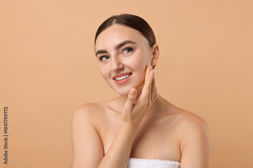 Beautiful young woman with healthy skin on beige background Beautiful young woman with healthy skin on beige background