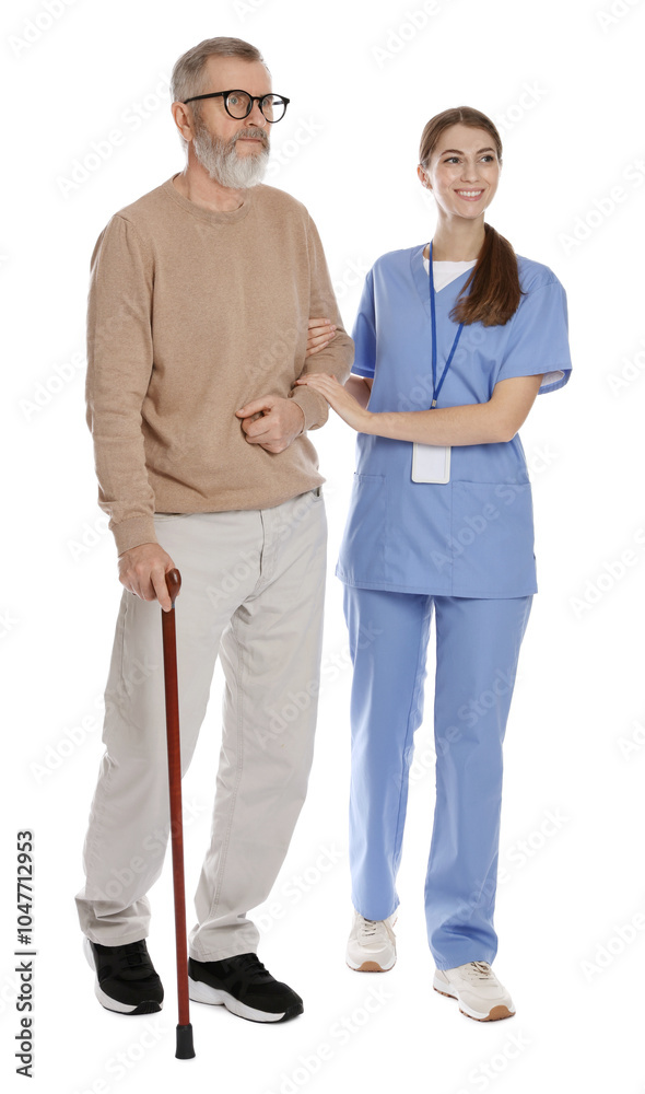 Caregiver supporting senior man with walking cane on white background. Home health care service