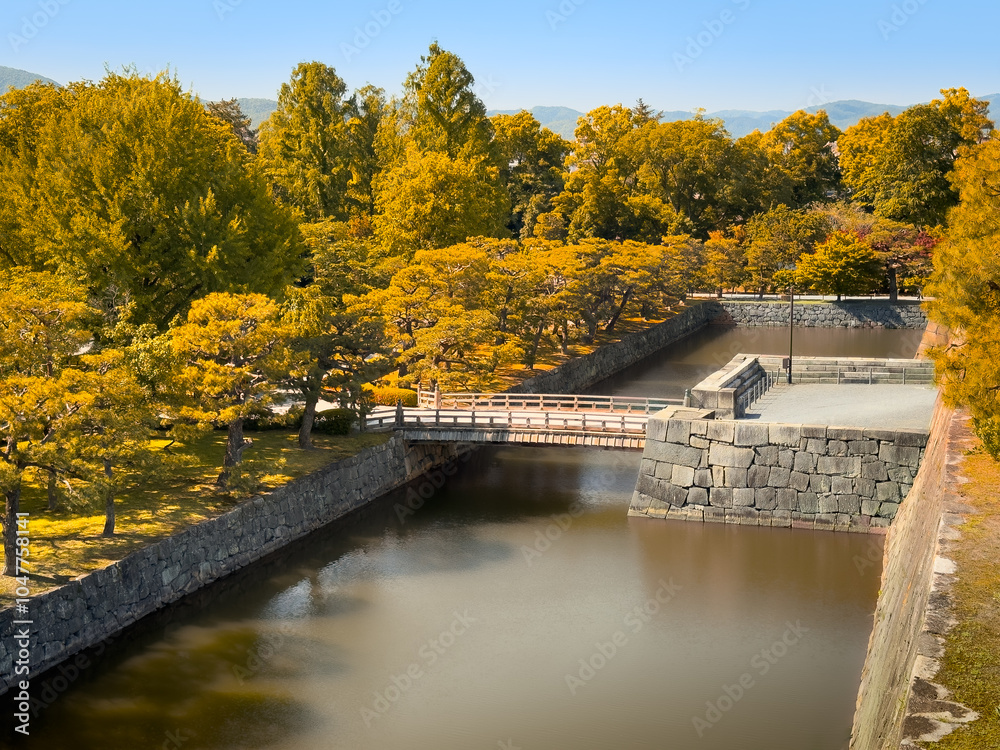 Witness the stunning beauty of a picturesque autumn scene at a historic Japanese castle Witness the stunning beauty of a picturesque autumn scene at a historic Japanese castle