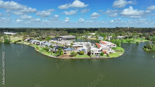 Aerial pullback of the resort houses and apartments on the lake shore