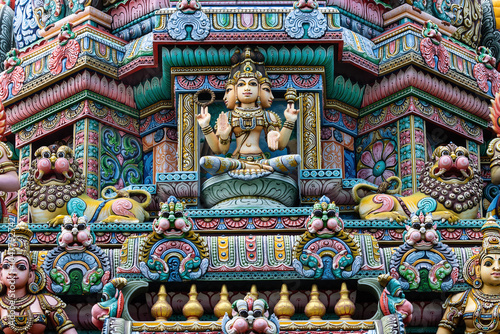 Colored decorations and statues on the exterior of the Hindu Temple Sri Maha Mariamman Temple (