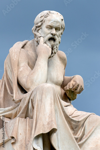 Close up of the marble statue of the ancient Greek philosopher Socrates in front of National Academy of Athens. Cloudy day